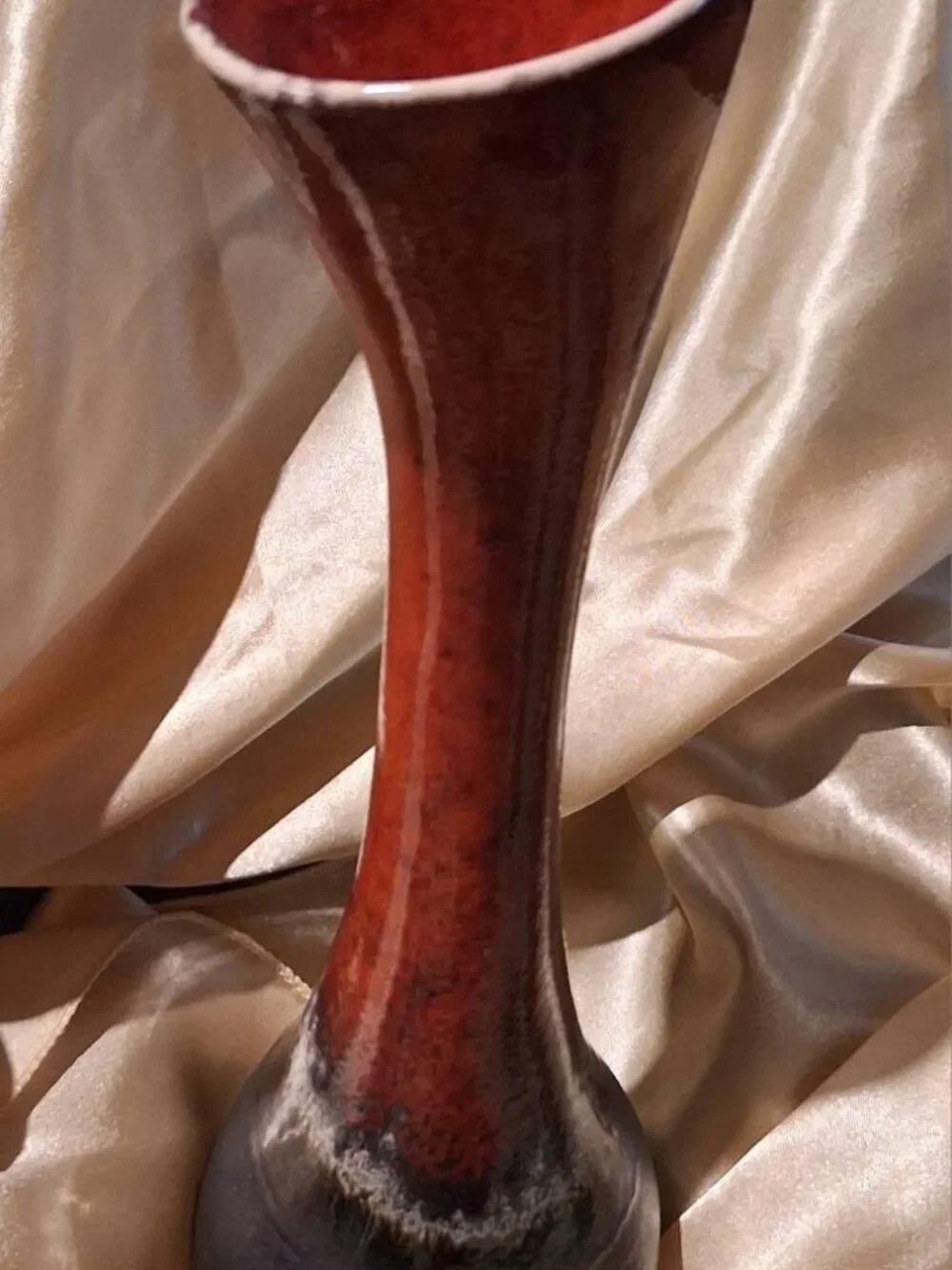 Organic, asymmetrical form paired w high-fire reactive lava/drip glazes